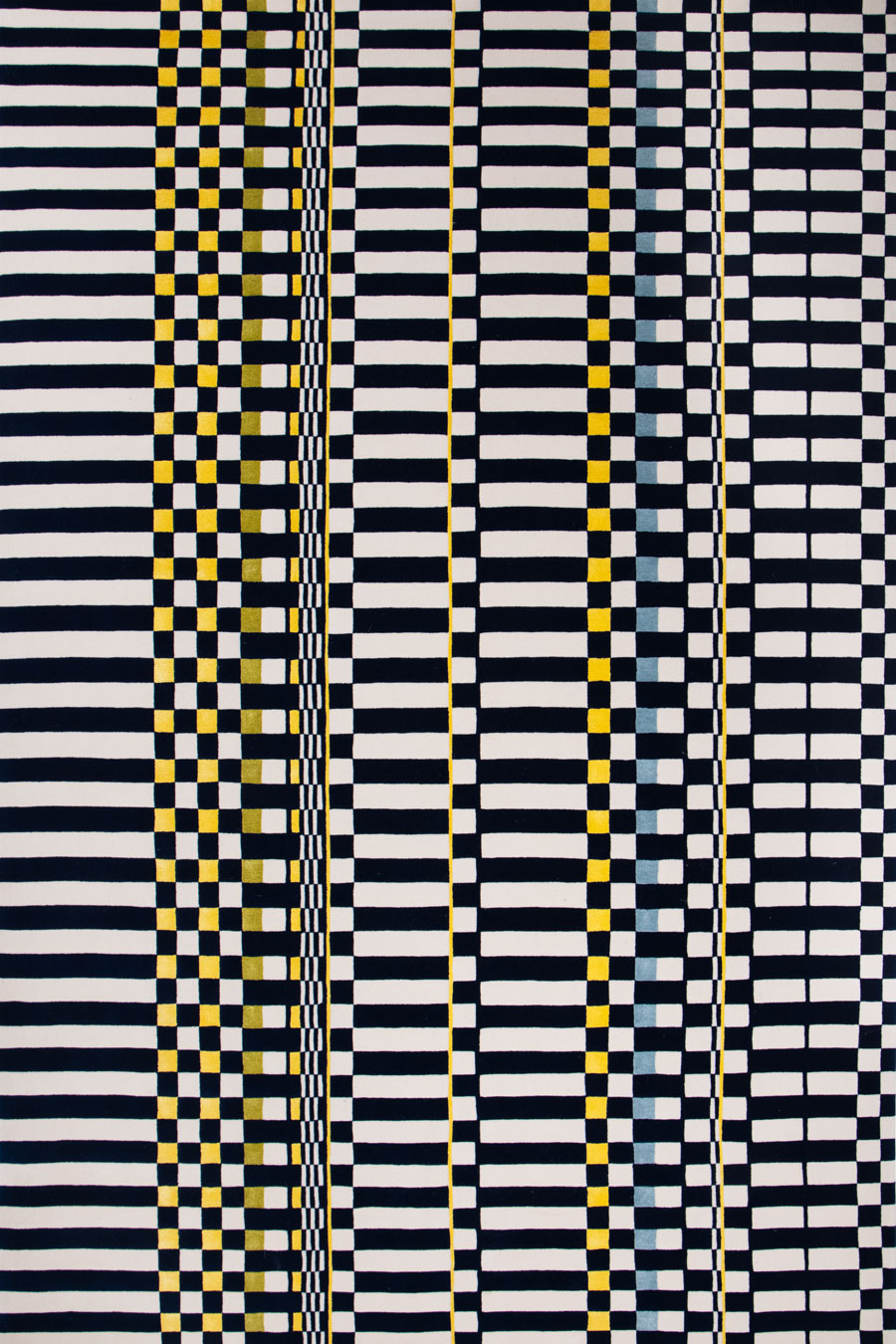 overhead of otto rug by anna spiro in navy and white geometric pattern