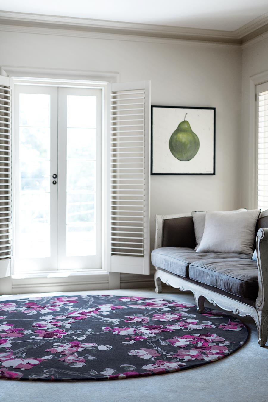 location living room shot of marguerite round rug by felicia aroney pink floral