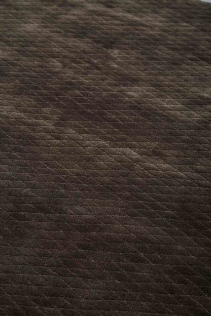 Close up view of textured Diamond Velour rug in dark brown colour